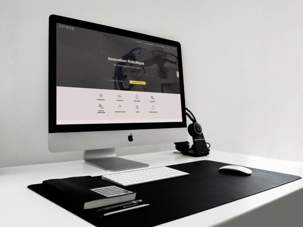 Ecran de bureau présentant le site internet multilingue d'Axiome